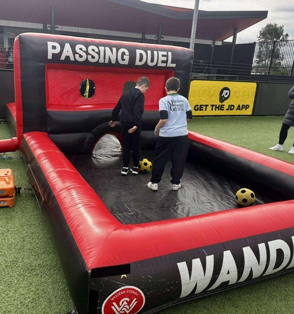 An image of 2 students attending Western Sydney Wanderers All Abilities Gala Day